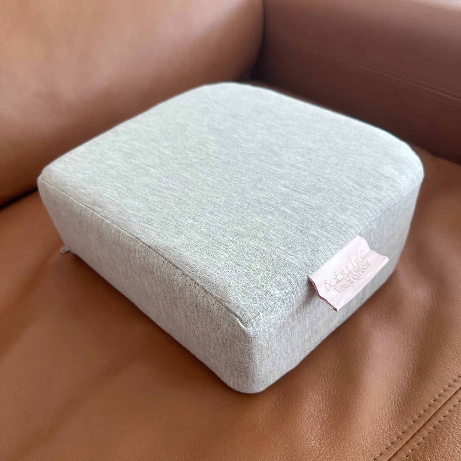 Grey, foam footstool for breast or bottle feeding good posture
